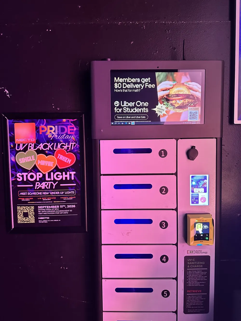Charging locker with a full-screen ad at a college nightclub